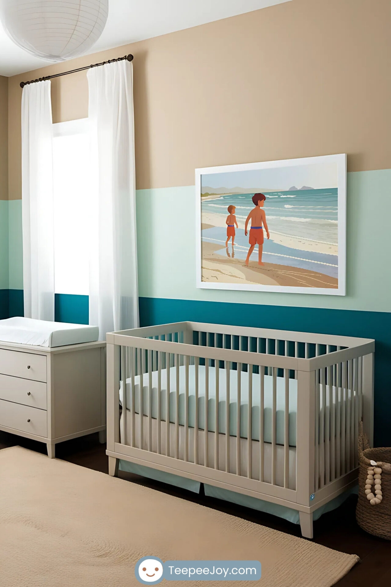 Beach-themed nursery featuring soft beige and teal color-blocked walls, a white crib with teal bedding, and matching furniture including a changing table and a cushioned armchair. The decor includes a framed illustration of two boys at the beach, complementing the serene and coastal vibe, with a woven rug and a striped beach ball completing the playful look.