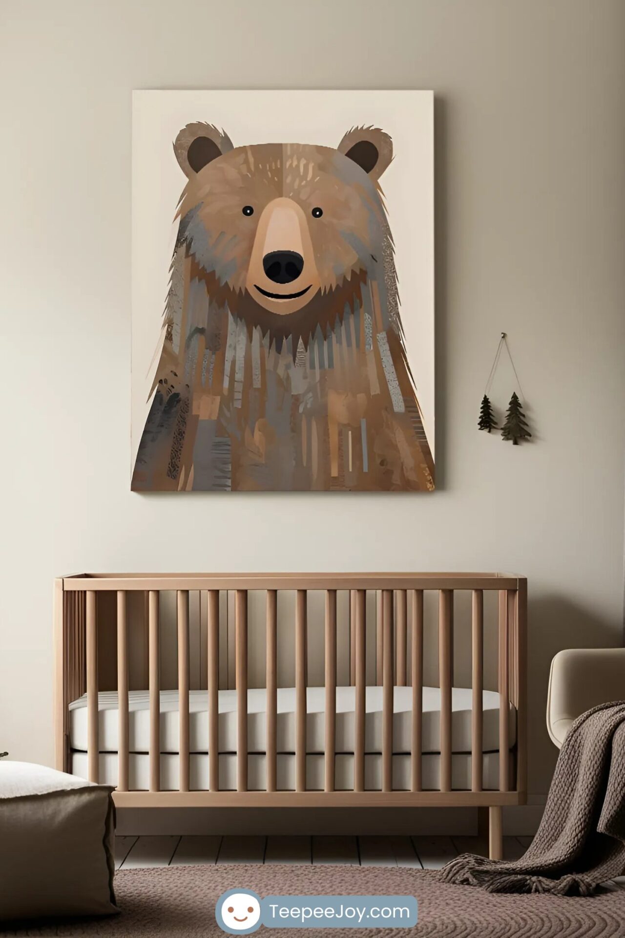 A cozy, nature-inspired nursery featuring a wooden crib with a neutral-toned mattress and a soft, textured rug. Above the crib hangs a large, modern wall art piece of a smiling bear in earthy brown tones, complementing the warm, minimalist decor. A set of small, hanging pine tree decorations adds a subtle woodland touch, while a knitted brown throw drapes over a nearby chair, enhancing the room's rustic charm.