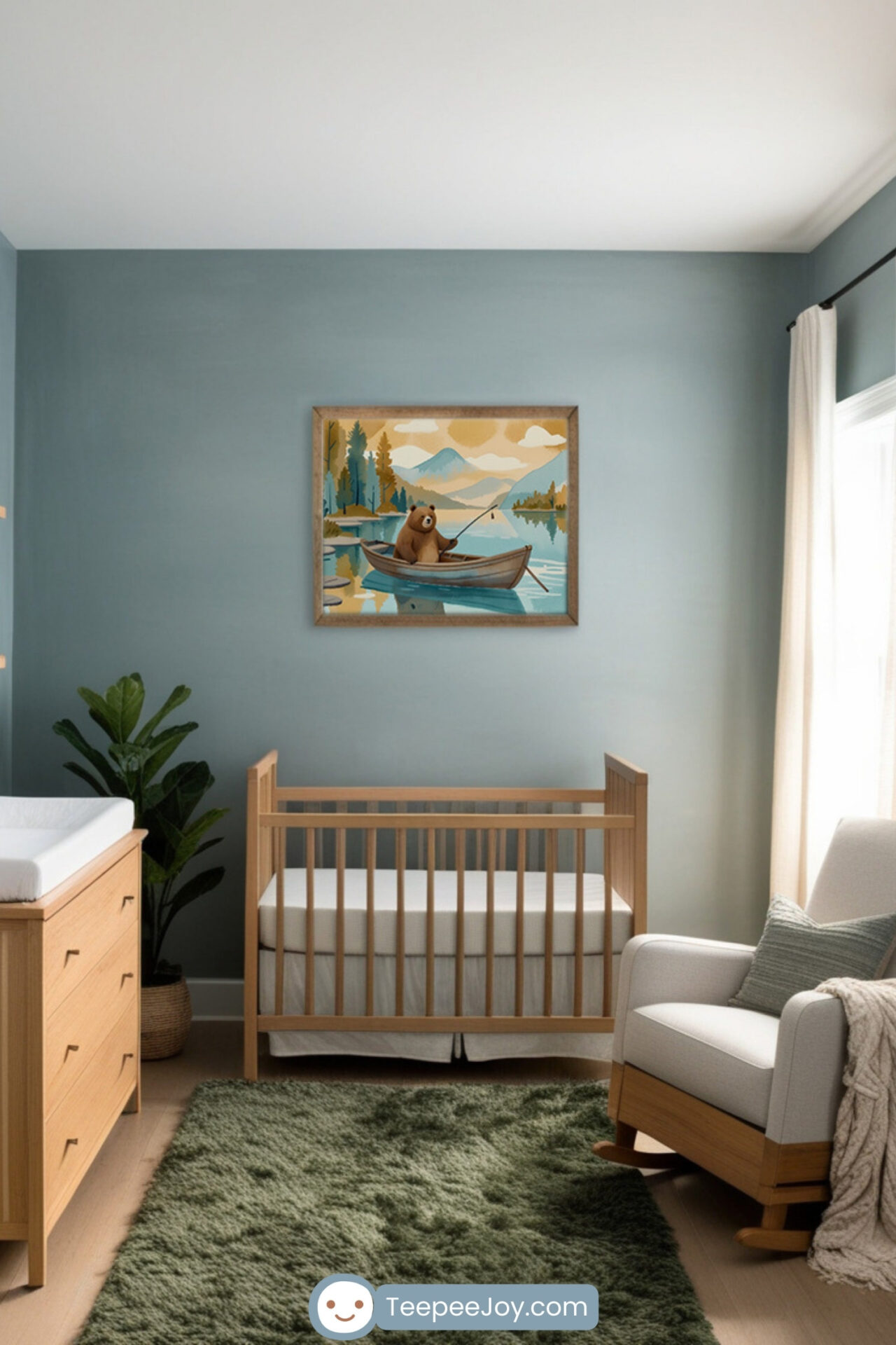 Tranquil nursery with a wooden crib against a soft blue wall, featuring a framed artwork of a bear fishing in a rowboat on a peaceful lake with mountains in the background. A cozy white rocking chair with a green accent pillow sits near a window with flowing white curtains. A plush green rug adds warmth to the serene, nature-inspired space.