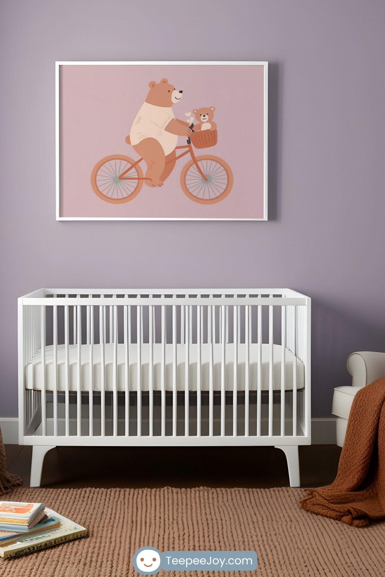 A cozy nursery with a modern white crib against a soft lavender wall. Above the crib hangs framed artwork featuring a cute illustration of a bear riding a bicycle with a baby bear in the front basket, set against a muted pink background. A knitted brown blanket and children's books rest nearby, adding warmth to the space.
