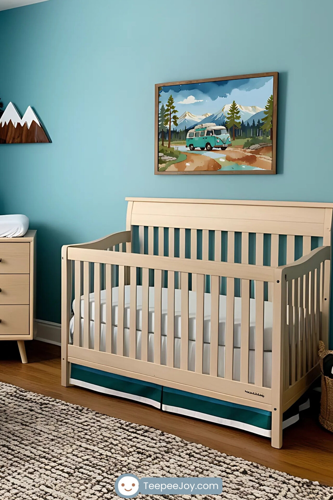 Adventure-themed nursery with teal walls and natural wood furniture, including a crib and a changing table. A framed illustration of a camper van in a mountain landscape hangs above the crib, adding a playful outdoor vibe. The room features a teal rocking chair, a patterned rug, tree-themed curtains, and mountain-shaped wall decor, creating a fun and cozy atmosphere inspired by nature.