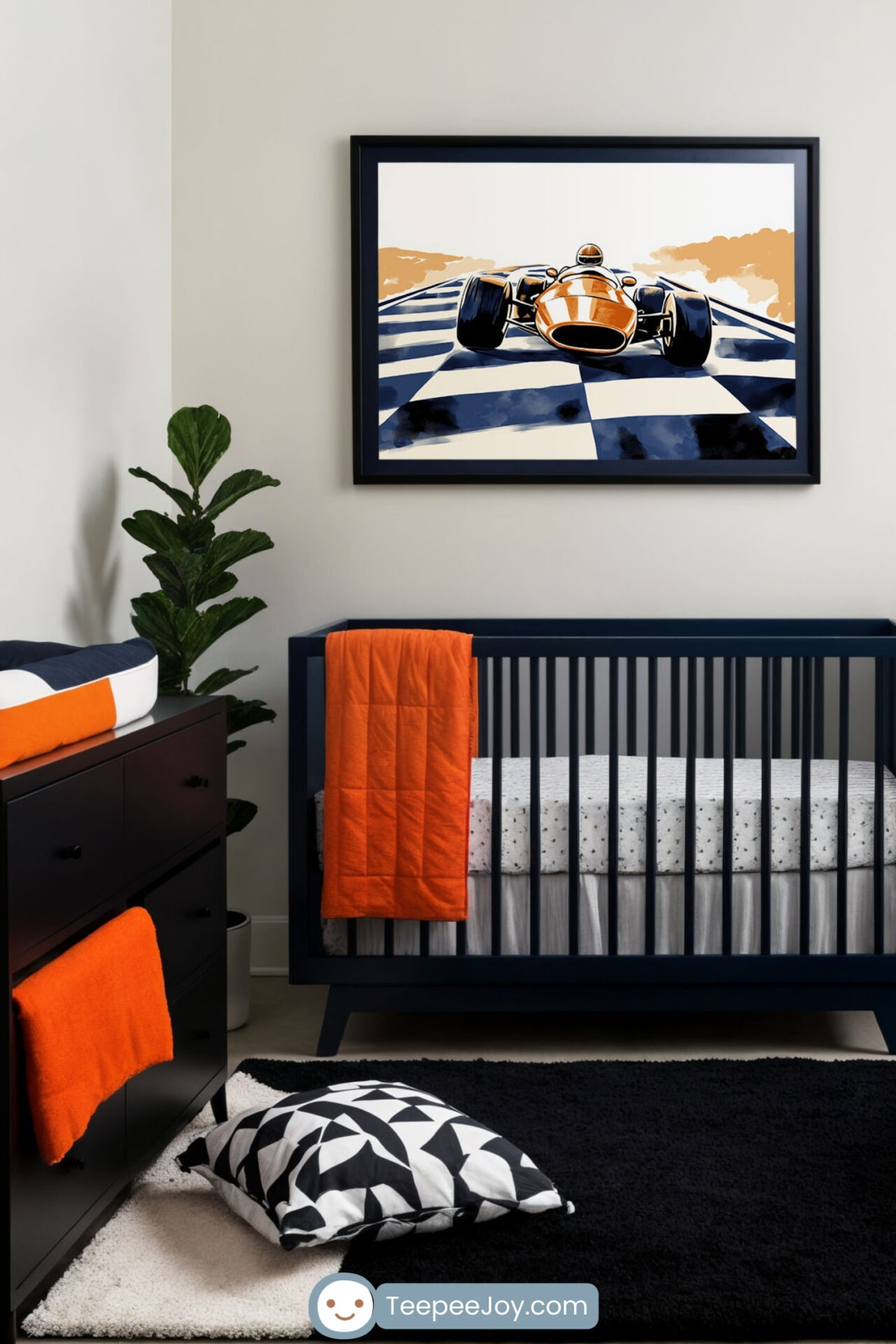 A modern race car-themed nursery with a navy crib, orange accents, and a black dresser. A framed race car illustration hangs above, complementing the black, white, and orange color scheme. A geometric pillow, a two-tone rug, and a potted plant add cozy touches.