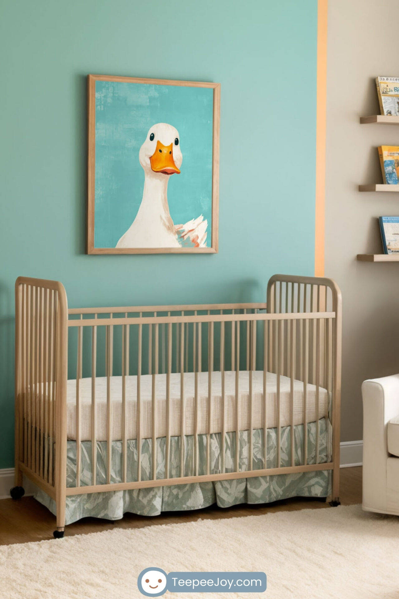 This image shows a cozy nursery with a framed art piece of a cheerful duck on a turquoise background, centrally placed on a wall with peach-colored accents. The room features a light wooden crib, a white armchair with an orange pillow, and wooden furniture, creating a warm and inviting space.