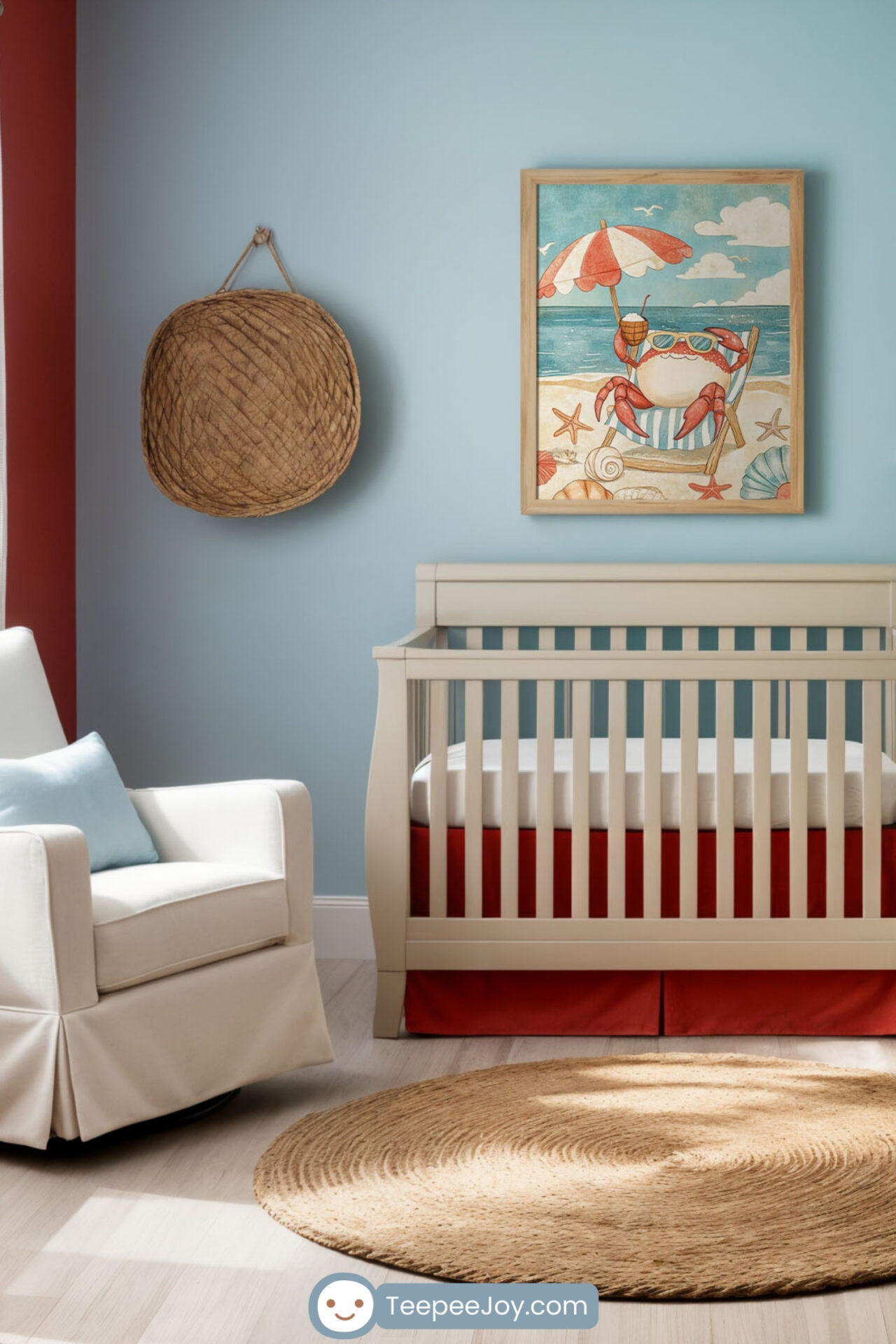 Bright and airy nursery with a beach-inspired theme, featuring a framed illustration of a lounging crab on a sandy beach above a white crib with red bedding. The room includes light blue and sandy beige walls, a jute rug, and decor like seashells, starfish, and a woven basket. A cozy white rocking chair with a blue pillow and a dresser with a changing table complete the coastal design.